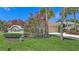 Community entrance sign surrounded by vibrant landscaping and mature trees at 201 Vestavia Dr, Venice, FL 34292