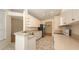 Open kitchen showcasing ample counter space, stainless appliances, and access to dining area at 201 Vestavia Dr, Venice, FL 34292