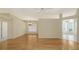 Spacious living room featuring hardwood flooring, neutral paint, and natural light at 201 Vestavia Dr, Venice, FL 34292