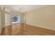 Bright living area with hardwood floors and sliding glass doors leading to the patio at 201 Vestavia Dr, Venice, FL 34292