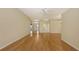 Open living area with hardwood floors, neutral walls, and ceiling fan at 201 Vestavia Dr, Venice, FL 34292