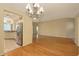 Hardwood floors accent the open living space leading into the kitchen, with recessed lighting at 201 Vestavia Dr, Venice, FL 34292
