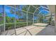Enclosed patio offering shade and a serene outdoor space with a tile platform at 201 Vestavia Dr, Venice, FL 34292