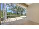 Enclosed patio offering shade and a serene outdoor space with a tile platform at 201 Vestavia Dr, Venice, FL 34292
