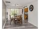 Dining room with wooden table, chairs, and sliding glass doors to the patio at 2020 E Crest Dr, Englewood, FL 34223