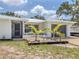 Inviting single-story home with a charming entrance and well-kept landscaping at 2020 E Crest Dr, Englewood, FL 34223