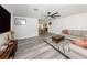 Bright living room with modern decor and gray wood-look flooring at 2020 E Crest Dr, Englewood, FL 34223