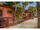 Relaxing outdoor patio area featuring cozy seating, lush foliage, and a inviting setting in a desirable neighborhood at 2020 E Crest Dr, Englewood, FL 34223
