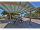 Shaded picnic area with tables and a scenic view of the ocean, great for outdoor dining at 2020 E Crest Dr, Englewood, FL 34223