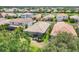Aerial view of the home, showing the backyard, roof, and surrounding neighborhood at 2034 Mesic Hammock Way, Venice, FL 34292