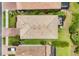 Bird's-eye view of the house highlighting its tile roof, screened lanai, and well-maintained landscaping at 2034 Mesic Hammock Way, Venice, FL 34292