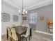 Cozy dining room featuring a chandelier, a dining table set, and hardwood floors at 2034 Mesic Hammock Way, Venice, FL 34292