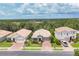 Charming single-Gathering home featuring a well-manicured front lawn and a brick-paved driveway at 2034 Mesic Hammock Way, Venice, FL 34292