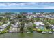 Stunning aerial view of waterfront homes, marinas, and the ocean, highlighting a coastal community's beauty at 205 Louella Ln, Nokomis, FL 34275