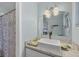 Updated bathroom with modern vessel sink, marble countertop and vanity at 205 Louella Ln, Nokomis, FL 34275
