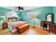 Cozy bedroom with wood floors, dresser and ample sunlight at 205 Louella Ln, Nokomis, FL 34275