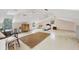 Expansive bonus room with a bed, desk, and plenty of space for activities and furniture at 205 Louella Ln, Nokomis, FL 34275