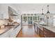Bright kitchen with stainless steel appliances, a large center island, and abundant counter space, designed for the modern chef at 205 Louella Ln, Nokomis, FL 34275