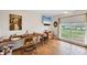 Bright home office with a large window overlooking a waterway and wood laminate flooring at 205 Louella Ln, Nokomis, FL 34275