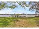Waterfront property offers tranquil water views, green space and seating, perfect for enjoying peaceful moments at 205 Louella Ln, Nokomis, FL 34275