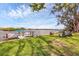 Picturesque waterfront view with dock and seating, inviting relaxation and enjoyment of waterfront living at 205 Louella Ln, Nokomis, FL 34275