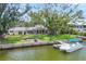 Beautiful waterfront home with lush backyard leading to private boat dock, perfect for outdoor recreation and relaxation at 205 Louella Ln, Nokomis, FL 34275