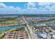 Wide aerial shot of community showing local bridge access and nearby commercial locations at 209 E Venice Ave, Venice, FL 34285