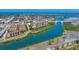 Beautiful aerial view of the waterfront community with nearby bridge and distant ocean views at 209 E Venice Ave, Venice, FL 34285