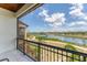 Waterfront balcony showcasing river views, blue skies and green trees at 209 E Venice Ave, Venice, FL 34285