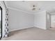 Spacious bedroom with carpet, neutral walls, and a large window at 209 E Venice Ave, Venice, FL 34285