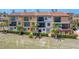 Exterior view of the property showing landscaping, patio access, and multiple levels at 209 E Venice Ave, Venice, FL 34285