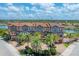 Beautiful exterior view of the townhome with private driveways, landscaping and waterfront location at 209 E Venice Ave, Venice, FL 34285