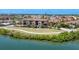 Luxury waterfront townhomes boasting tile roofs and lush landscaping at 209 E Venice Ave, Venice, FL 34285
