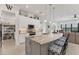 Spacious kitchen island with seating and open floorplan with water view at 209 E Venice Ave, Venice, FL 34285