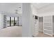 Bedroom leading into large walk-in closet and access to private balcony at 209 E Venice Ave, Venice, FL 34285
