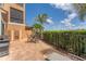 View of the patio including dining table and chairs, grill, lounge chair and green surroundings at 209 E Venice Ave, Venice, FL 34285