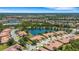 An aerial perspective showing the layout of a community with winding roads and backyard ponds at 2104 Batello Dr, Venice, FL 34292