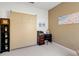 Small room features wall bed, desk, shelving, and neutral wall color at 2104 Batello Dr, Venice, FL 34292