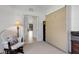 Small room features wall bed, desk, shelving, and neutral wall color at 2104 Batello Dr, Venice, FL 34292