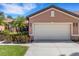 Charming single-Gathering home featuring a two-car garage and well-maintained landscaping at 2104 Batello Dr, Venice, FL 34292