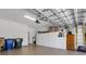 Organized garage featuring storage cabinets, shelving, and space for vehicles, ensuring a clutter-free area at 2104 Batello Dr, Venice, FL 34292