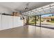 Spacious garage featuring installed cabinets for storage with an open door allowing natural light at 2104 Batello Dr, Venice, FL 34292