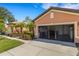 Attached garage with installed storage system and an open garage door allowing lots of natural light at 2104 Batello Dr, Venice, FL 34292