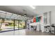 Spacious garage with ample storage, showcasing an open door to the driveway and organization racks at 2104 Batello Dr, Venice, FL 34292