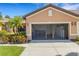 Two-car garage featuring shelving and storage space at 2104 Batello Dr, Venice, FL 34292