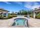 Community hot tub and pool with beautiful pavers and tropical landscaping at 2104 Batello Dr, Venice, FL 34292