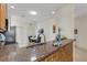 Bright kitchen featuring granite countertops, stainless steel appliances, and a cozy breakfast nook at 2104 Batello Dr, Venice, FL 34292