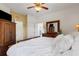 Spacious main bedroom with ensuite, and view of the bedroom's dresser and mirror at 2104 Batello Dr, Venice, FL 34292