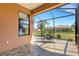 Relaxing screened-in patio featuring tile flooring and comfortable lounge chairs, perfect for enjoying the outdoors at 2104 Batello Dr, Venice, FL 34292