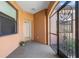 Cozy screened entry with neutral paint, tile flooring, and view to the front door at 2104 Batello Dr, Venice, FL 34292